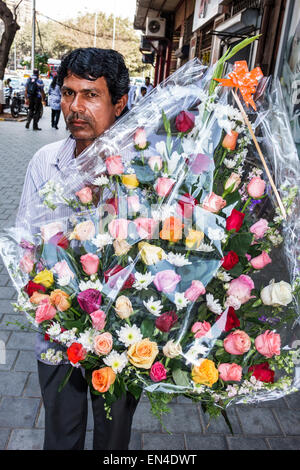 Mumbai India,Churchgate,Veer Nariman Road,man men male,delivering,wreath,rose,roses,flowers,India150226092 Stock Photo