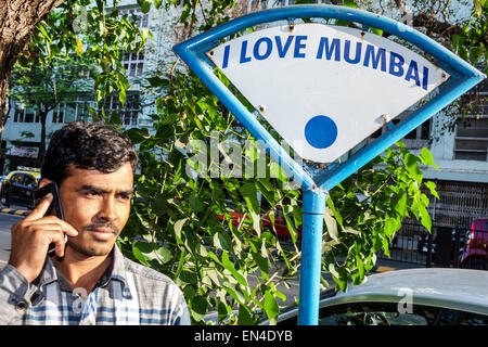 Mumbai India,Churchgate,Veer Nariman Road,man men male,smartphone cell phone phones texting,using,sign,I Love,India150226120 Stock Photo