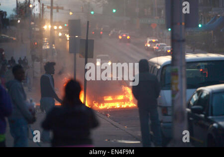 Baltimore, USA. 27th Apr, 2015. A car burns in Baltimore, Maryland, the United States, April 27, 2015. Maryland governor Larry Hogan Monday evening declared a state of emergency and activated the National Guard to address the escalating violence and unrest in Baltimore City following the funeral of a 25-year-old black man who died after he was injured in police custody. Credit:  Yin Bogu/Xinhua/Alamy Live News Stock Photo
