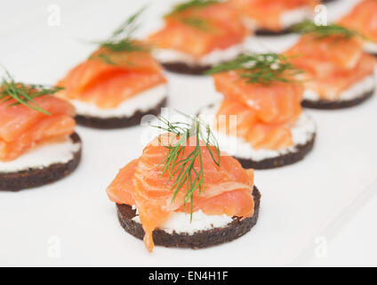 canapes with cheese and red fish Stock Photo