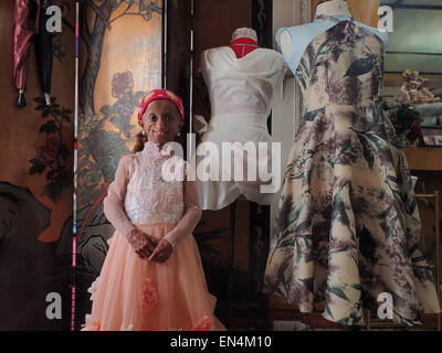 Quezon City, Philippines. 27th April, 2015. Young designer Amiel Avena creates the gown of progeria sufferer Rochelle Pondare for her 18th birthday celebration on May 30, 2015. Kids with progeria has life span of 13-15 years old only, but due to new medicines discovered to prolong the lives of kids affected with this rare genetic abnormality that causes fast aging, Pondare will reached eighteen next month to celebrate her debut party and she is looking forward to dance with her first love, Ricardo.  It's first time in the Philippines that a progeria sufferer can celebrate her womanhood. © Sher Stock Photo