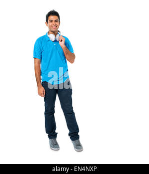 Confident Young Man Standing and Smiling Stock Photo