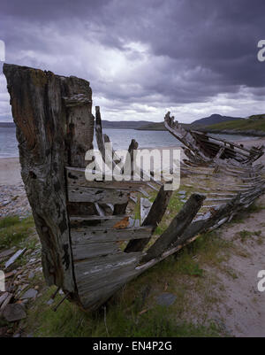 The wreck of an old fishing boat aground at Talmine Bay, Talmine, Kyle of Tongue, Sutherland, Scotland, UK. Stock Photo