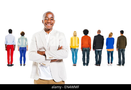 Back View of Multi-Ethnic People and a Man Standing Out From the Crowd Stock Photo