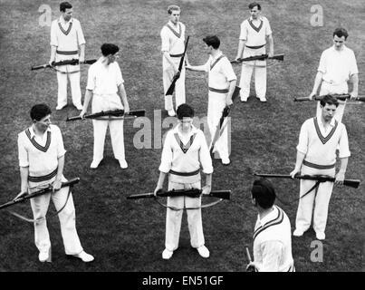 Under their new coach, ex-Gloucestershire player George Lambert, the member of the Somerset County team get rifle drill for a short period every day, in order to get their wrists and arms loosened for the upcoming season. Here they are pictured during the Stock Photo