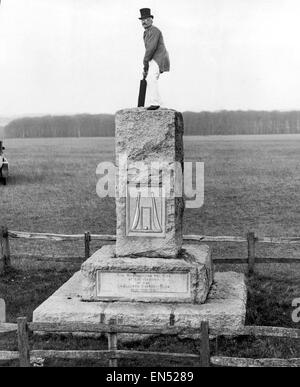 Piccolo Jim stands atop a stone marking the site of the ground of the Hambledon Cricket club in Hampshire. 1st January 1929. Stock Photo