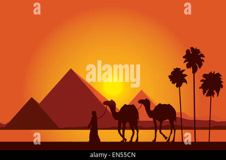 Egypt Great Pyramids with Camel caravan on sunset background Stock Photo