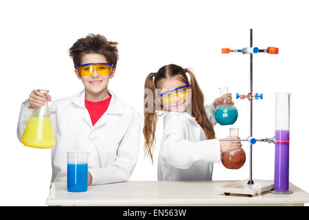 Two cute children at chemistry lesson making experiments Stock Photo