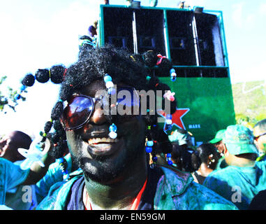 Philipsburg, St Maarten. 27th April, 2015.  Revellers masquerade wearing mud, paint and costumes in the  J'ouvert Street Parade during Carnival in Philipsburg, St Maarten on Monday April 27, 2015.  Credit:  Sean Drakes/Alamy Live News Stock Photo