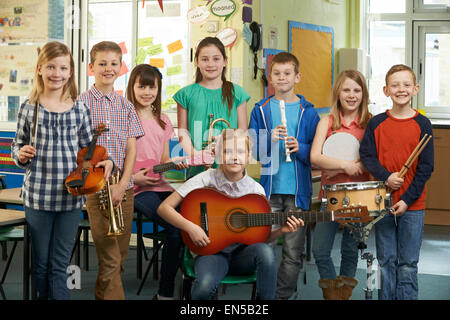 Portrait Of Students Playing In School Orchestra Together Stock Photo