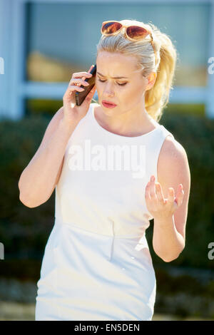 Business woman using mobile phone Stock Photo