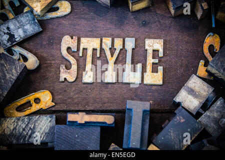 The word STYLE written in rusted metal letters surrounded by vintage wooden and metal letterpress type. Stock Photo