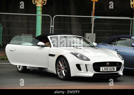 A white Jaguar F-Type convertible parked along Madeira Drive in Brighton after completing the London to Brighton Jaguar Run. Stock Photo