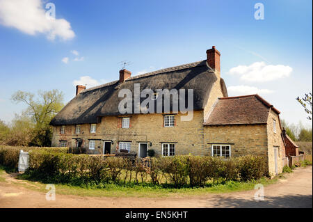 A traditional Cotswold row of cottages in Oxfordshire UK Stock Photo