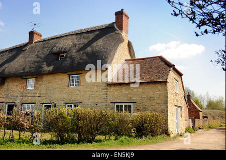 A traditional Cotswold row of cottages in Oxfordshire UK Stock Photo