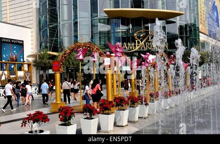 Bangkok, Thailand:  Splashing fountains and Christmas decorations with pink angels at the upscale Siam Paragon Stock Photo