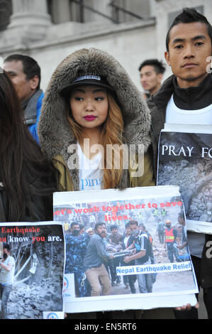 Trafalgar Square, London, UK. 28th April 2015. Members of Britain's Nepalese community hold prayers in Trafalgar Square for those affected in the  earthquake which has killed over 4,500 people in Nepal. The 'Pray for Nepal', vigil is organised by London Universities' Nepali Society. Credit:  Matthew Chattle/Alamy Live News Stock Photo