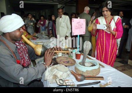 Visitors take keen interest at stall during National Conference on Issues Faced by Gypsies and Way Forward organized by GODH held at local hotel in Lahore on Tuesday, April 28, 2015. Stock Photo