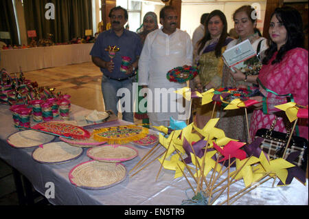 Visitors take keen interest at stall during National Conference on Issues Faced by Gypsies and Way Forward organized by GODH held at local hotel in Lahore on Tuesday, April 28, 2015. Stock Photo