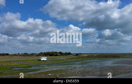 A camper van pictured in a beauty spot in Keyhaven, The New Forest, Hampshire, UK Stock Photo