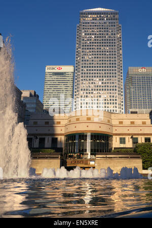 BANKS TOWERS CANARY WHARF FOUNTAINS afternoon spring sun illuminates Cabot Square Canary Wharf London financial district including HSBC and Citi Banks Stock Photo