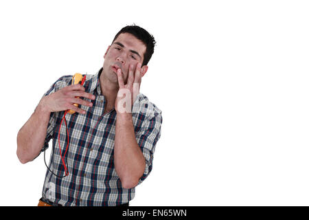 electrician injured by electric shock Stock Photo