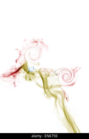 Colorful smoke on white background in form of woman's silhouette Stock Photo