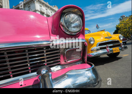 HAVANA, CUBA - JUNE 13, 2011: Colorful vintage American cars stand parked in Central Havana. Stock Photo