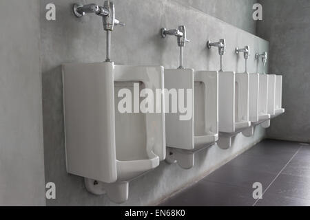 public restroom - urinals in a row Stock Photo