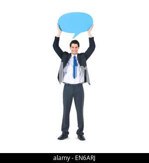 A Businessman holding a Blue Speech Bubble Stock Photo
