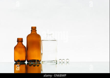 Empty various medicine bottles on the light background Stock Photo