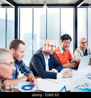 Group Of Business People Working In A Board Room Having A Meeting Stock Photo