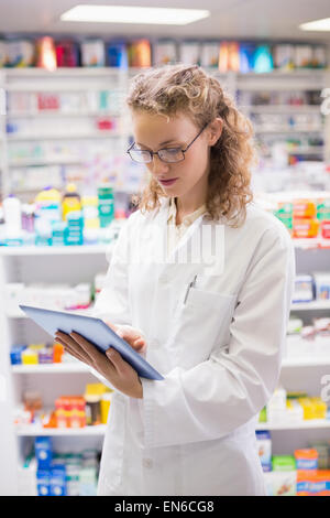 Pharmacist using tablet pc Stock Photo