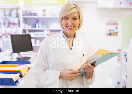 Pharmacist files documents Stock Photo