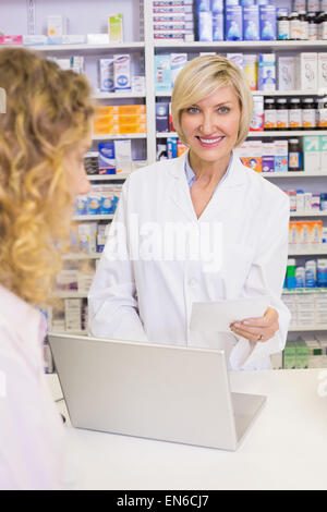 Pharmacist using the computer Stock Photo