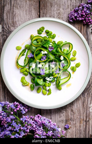 Asparagus, broad beans and lilac salad Stock Photo