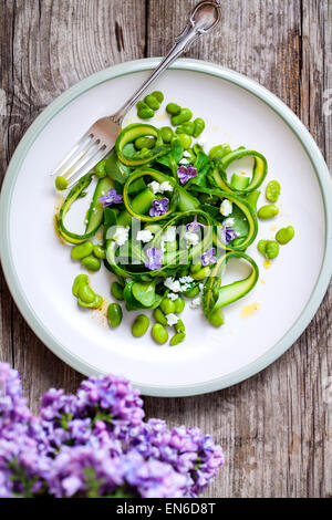 Asparagus, broad beans and lilac salad Stock Photo