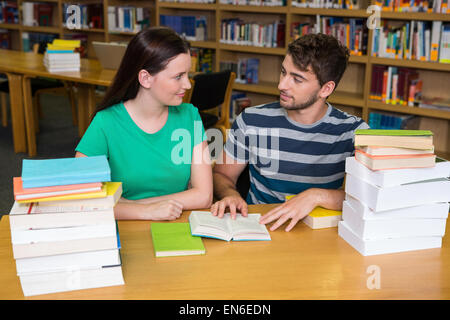 Students studying together in the library Stock Photo