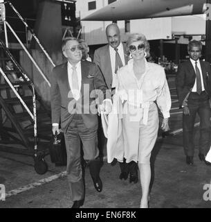 Frank Sinatra and wife Barbara Marx seen at Heathrow Airport prior to departing for New York aboard Concorde. 31st july 1984 Stock Photo