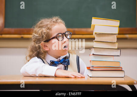 Surprise pupil looking at books Stock Photo