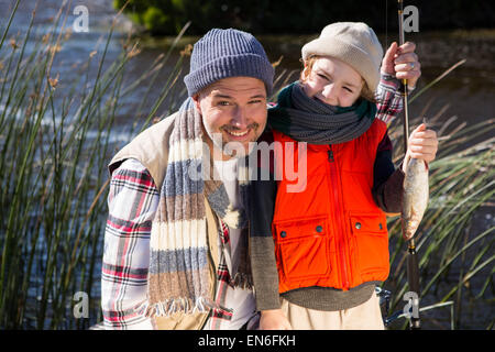 Happy man fishing with his son Stock Photo