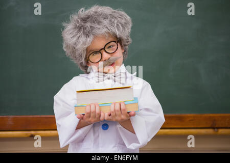 Dressed up pupil holding books Stock Photo