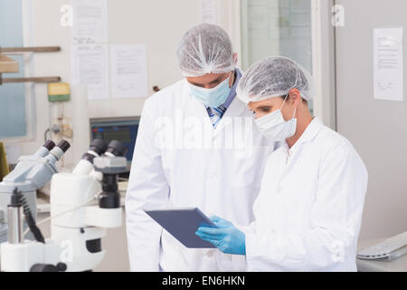Scientists using tablet Stock Photo