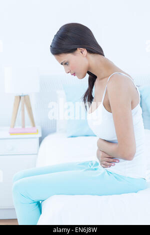Pretty woman suffering from stomach pain Stock Photo