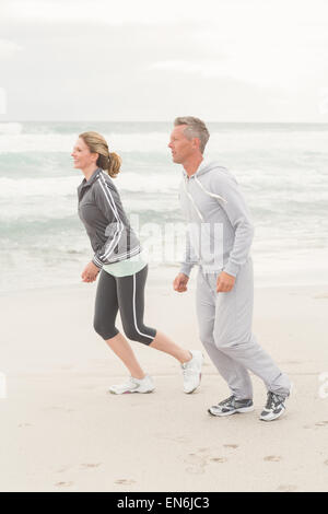 Fit couple jogging together Stock Photo