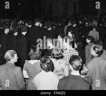 Scenes in and around Bramley Road in Notting Hill, where police were called to prevent trouble between black and white residents in the area. There were several scuffles and some people were arrested and taken away in police vans. 31st August 1958. Stock Photo