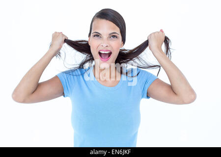 Furious woman pulling her hair Stock Photo