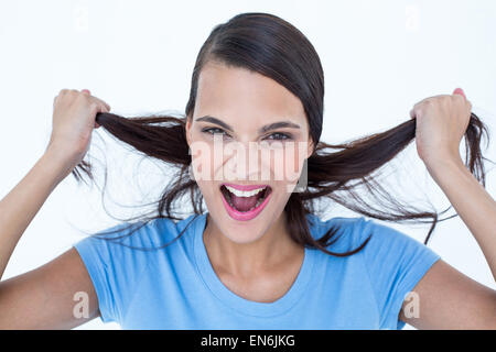 Furious woman pulling her hair Stock Photo