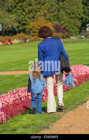 Grandmother and granddaughter walking through park on Margaret Island, Budapest, Hungary Stock Photo