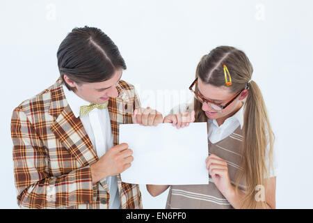 Geeky hipsters holding a poster Stock Photo